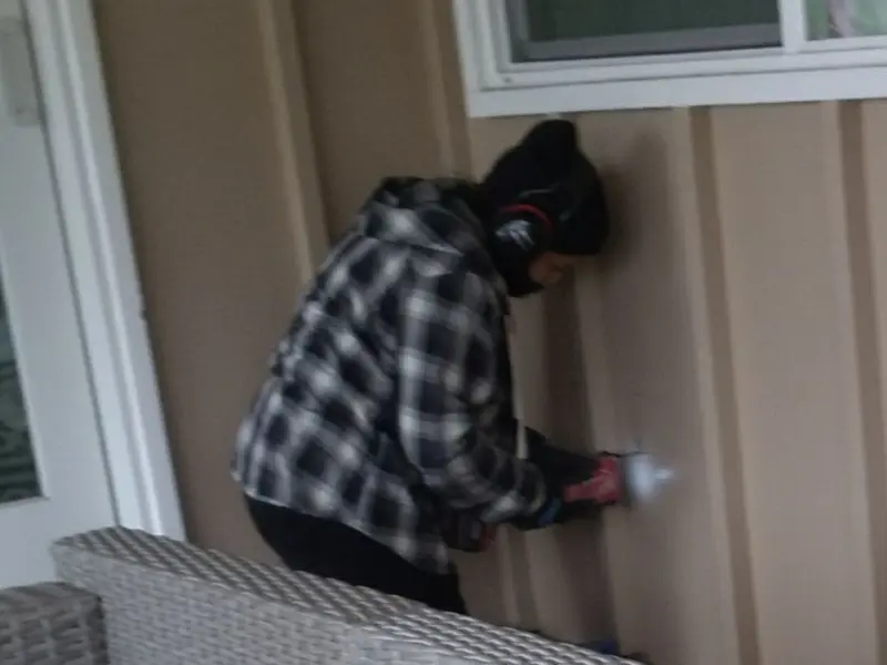 Professional electrician installing an exterior outlet in Bend