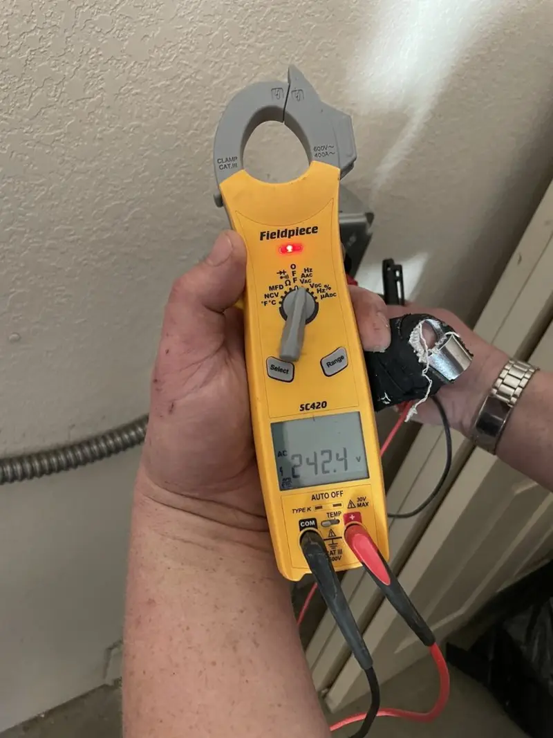 Voltage testing with clamp meter during Outlet Installation in Bend